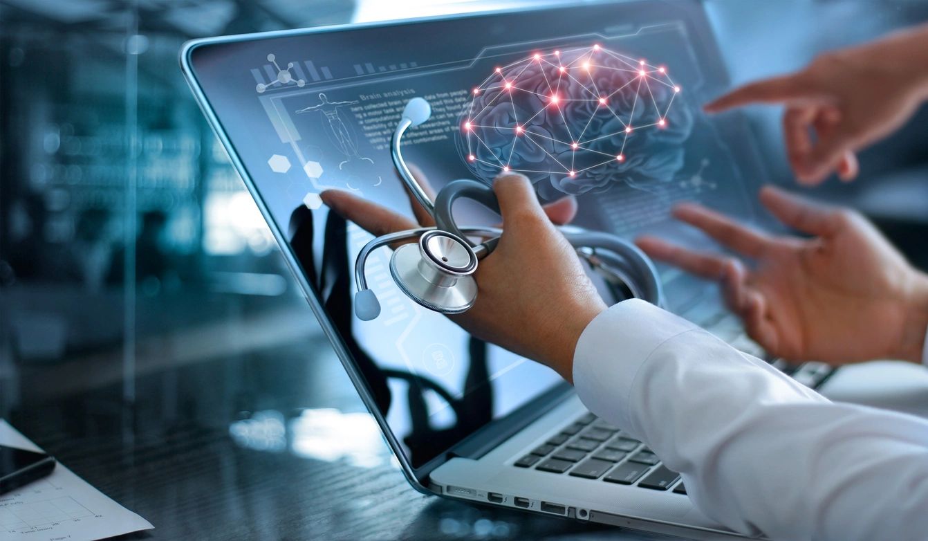 Medical technology concept with laptop and stethoscope.